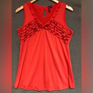 Milano medium red orange V-neck top with ruffles a long bodice and neck.